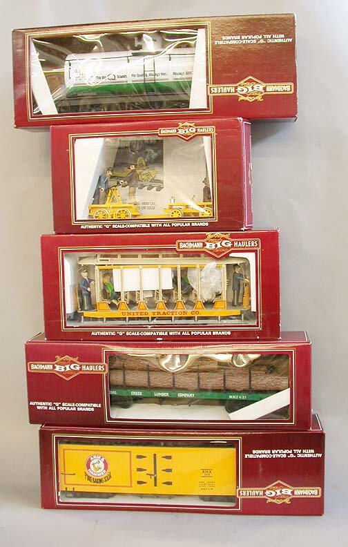 BACHMAN BIG HAULER TRAINS "G" SCALE. 5: BACHMAN BIG HAULER TRAINS "G" SCALE. 5 pieces, including trolley, arm & hammer car, lumber car, hand car, oil car. Condition: Excellent. In original package.