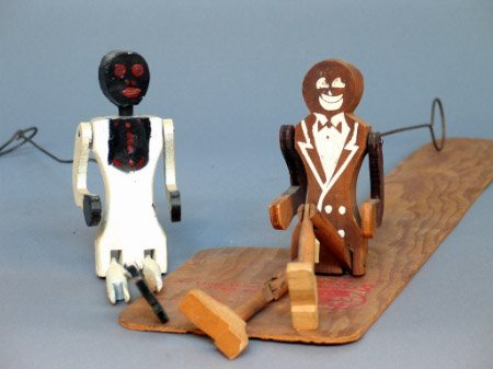 TWO STEPPIN SAM FIGURES. The lot includes two woo