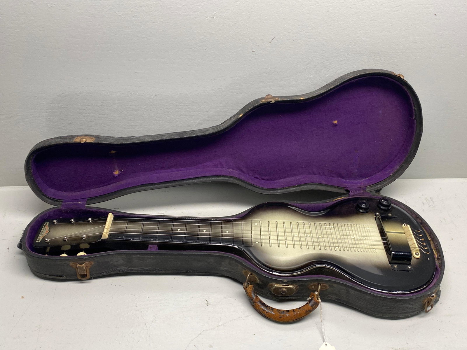 Rickenbacker 1941 model lap steel in black sunburst: Rickenbacker 1941 model lap steel in black sunburst some chips and finish wear. All guitars, stringed instruments, amplifiers, parts, and pedals in this auction are sold as/is. We have done our best t