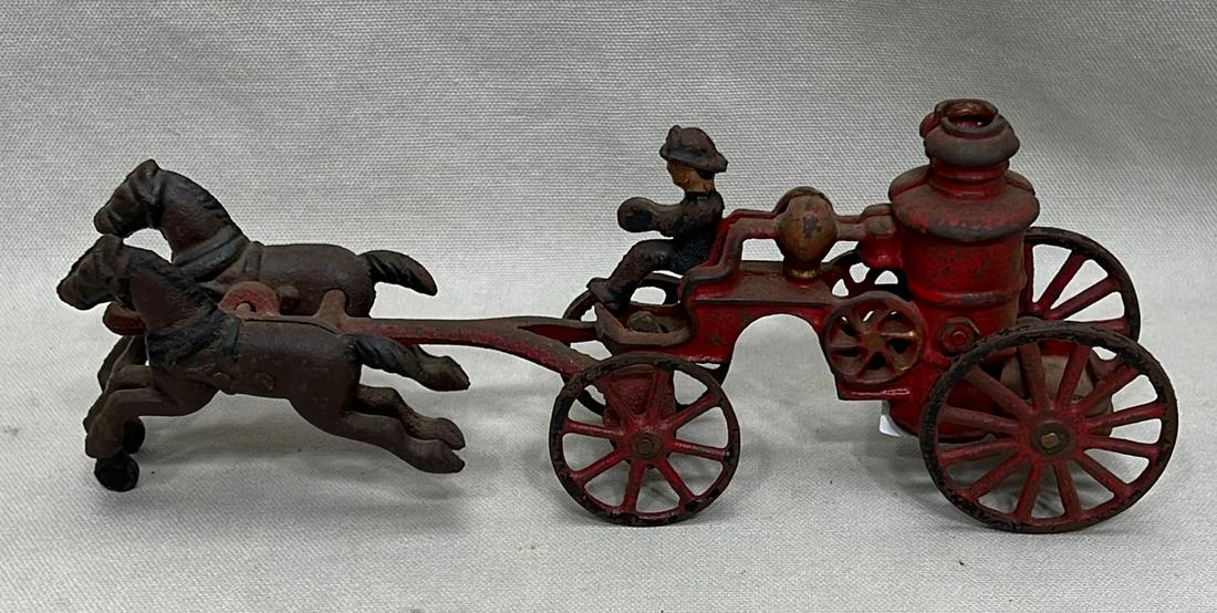 American cast iron horse-drawn fire pump toy: late 19th to early 20th century, appx. 9 1/2" long