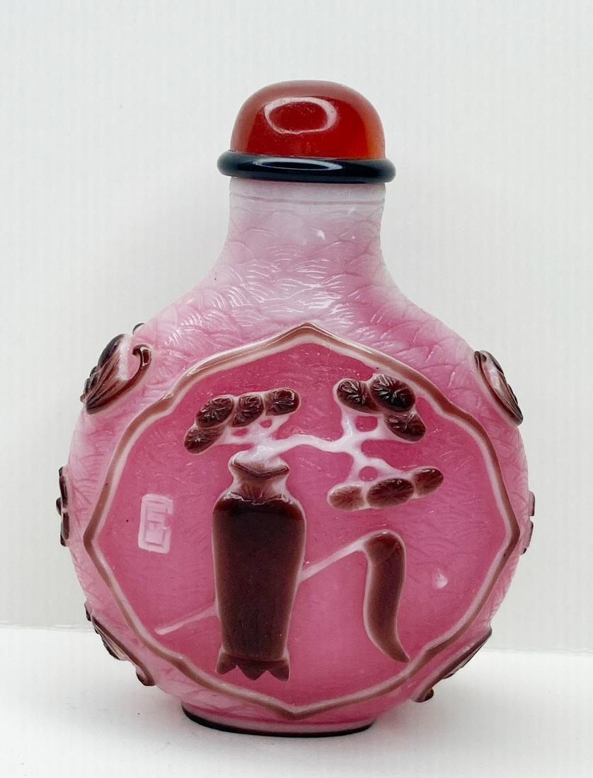 Chinese Carved Peking Glass Snuff Bottle: 2 3/4" tall, 2 1/4" at widest.