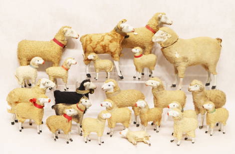 (23) German putz sheep including candy container: German, 19th century. Sizes from 4 1/2" x 5 3/4" to 1 7/8" x 2 1/8". The largest is the candy container. Typical condition with minor losses, some with cockeyed legs and not standing.