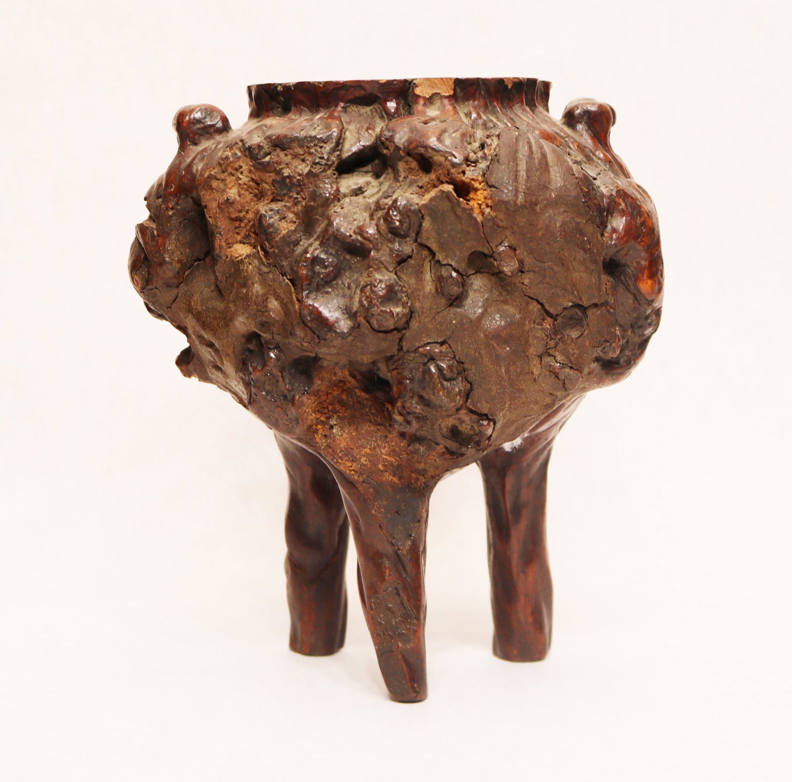 Chinese carved burlwood tripod censer: 19th century or earlier. 8 3/8" high. Natural splits in wood.