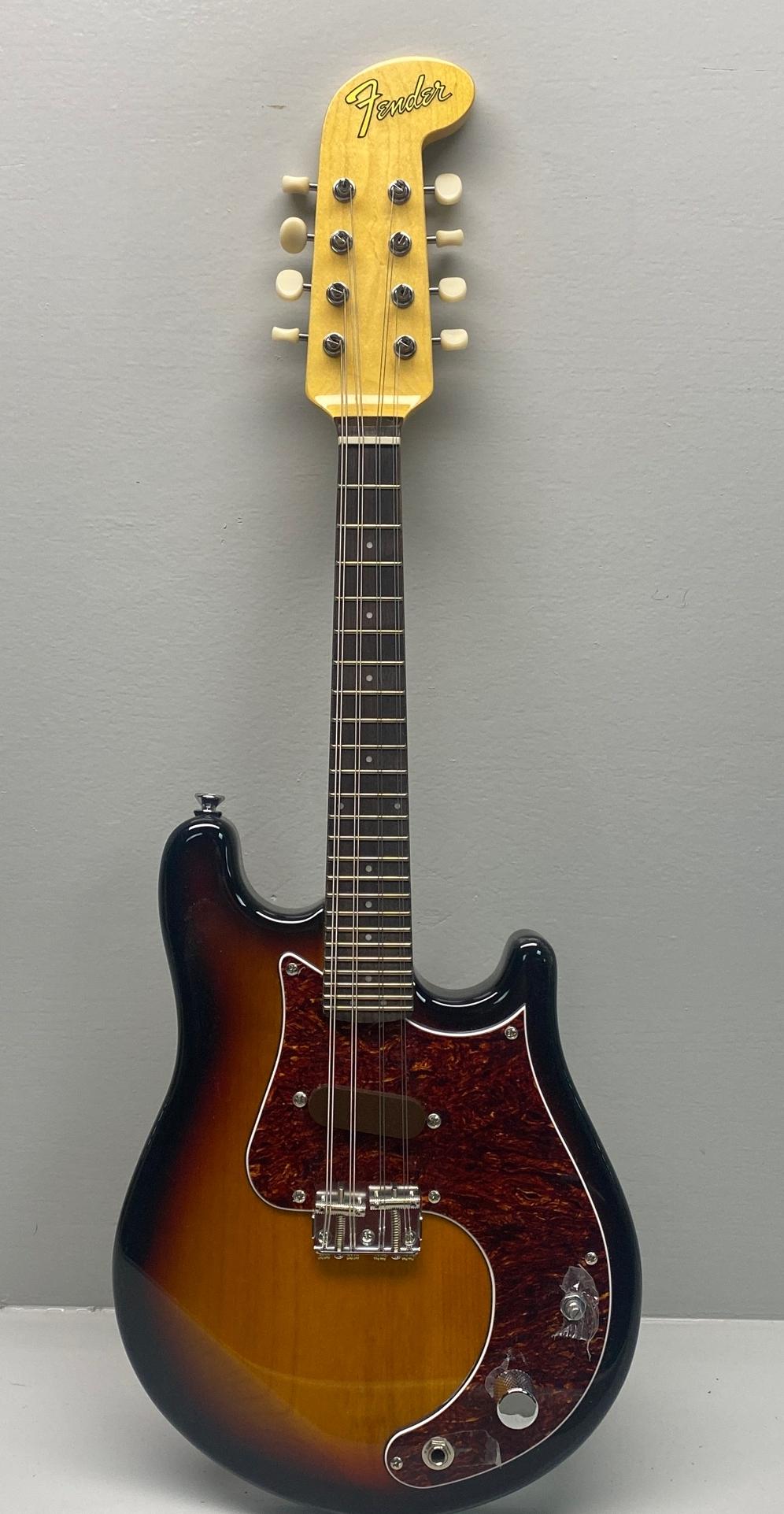 Fender 2015 Mando-Strat In Sunburst: Excellent condition. Fender hard case included. All guitars, stringed instruments, amplifiers, parts, and pedals in this auction are sold as/is. We have done our best to inspect for any major visible