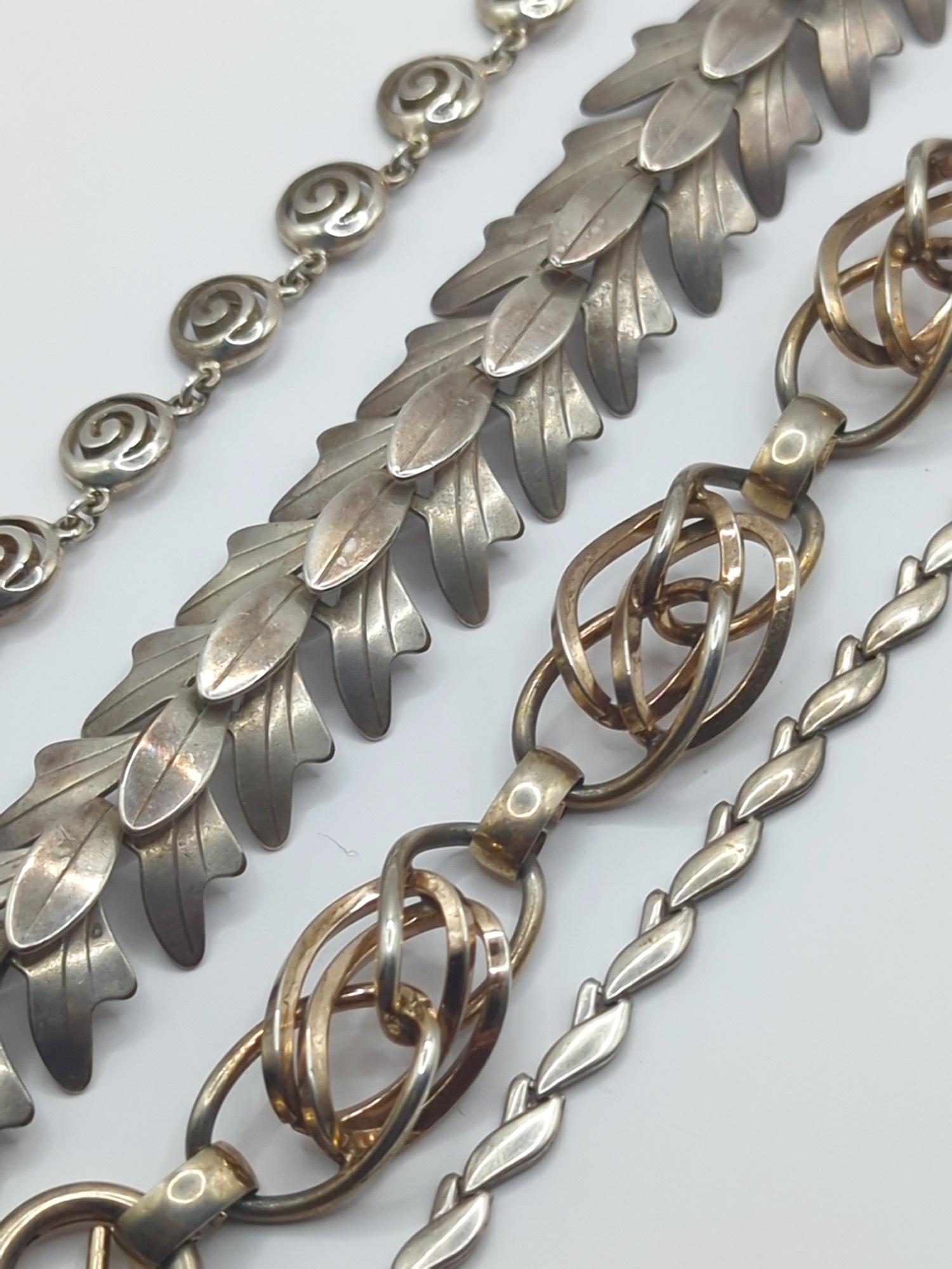 FRANCISCO REBAJES, NAPIER, ETC; Modernist Sterling Silver Jewelry: Rebajes marked necklace for a 16" neck, 7/8" wide, Napier marked bracelet for a 7" wrist, two 16" necklaces without maker's marks. Good condition. 148 grams.