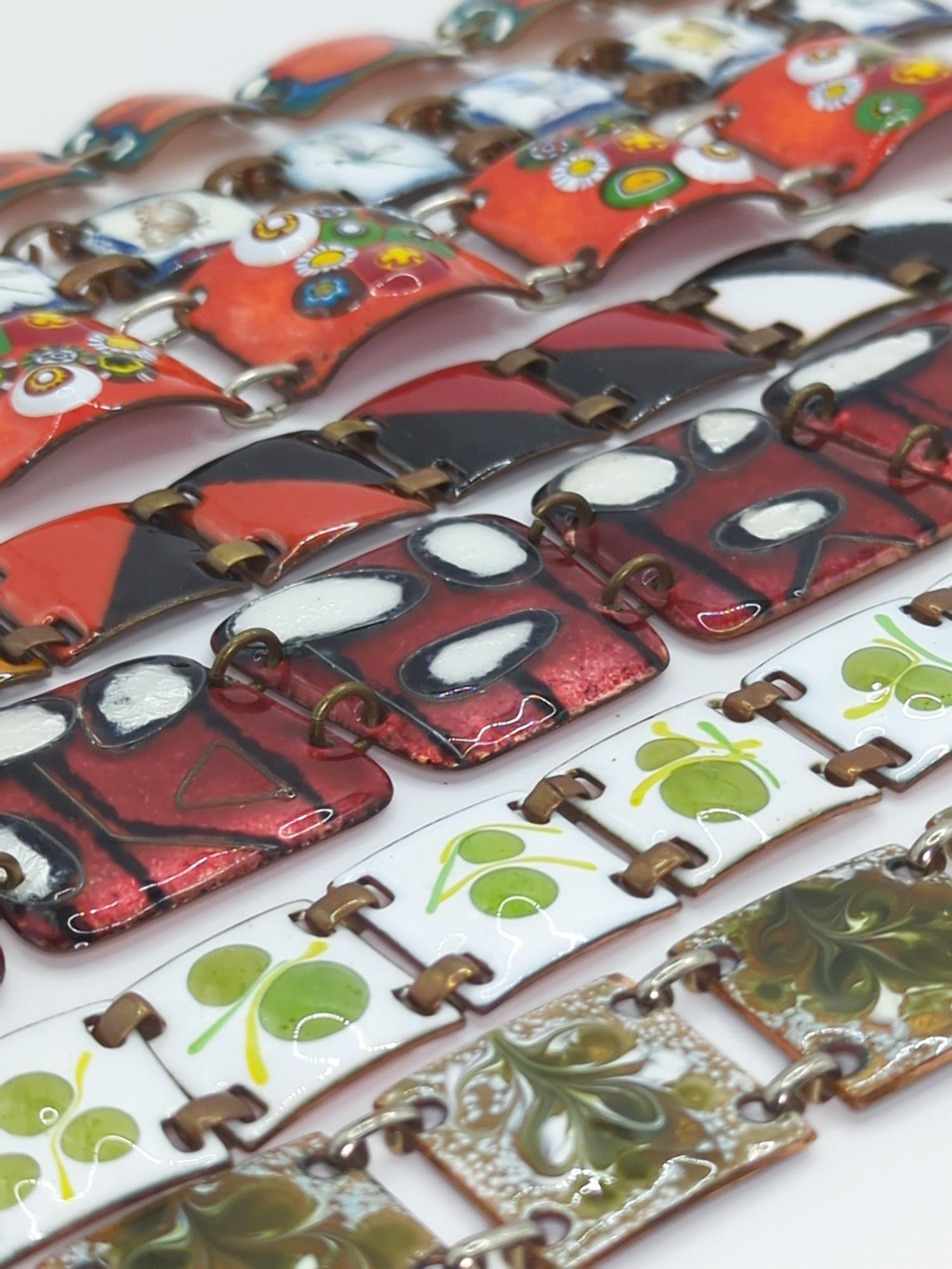 FUSED GLASS ENAMEL JEWELRY; Seven Modernist Link Bracelets: Lengths from 6 1/2" to 7 1/2", widths from 3/4" to 1 1/2". Good condition with minor edge imperfections.