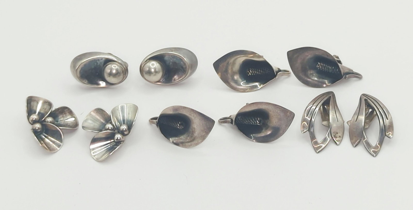 NIELS ERIK FROM, DANISH; Five Pair Modernist Sterling Silver Earrings: 20th century. Sizes from 1" to 1 1/4", 35 grams. One screw back, the balance clips. Good condition.