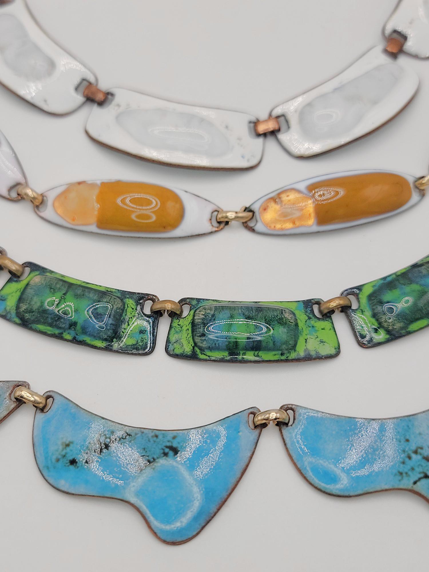 KAY DENNING; Four Modernist Fused Glass Enamel Copper Necklaces: Lengths from 14" to 15", widths from 1/2" to 3/4". Good condition.