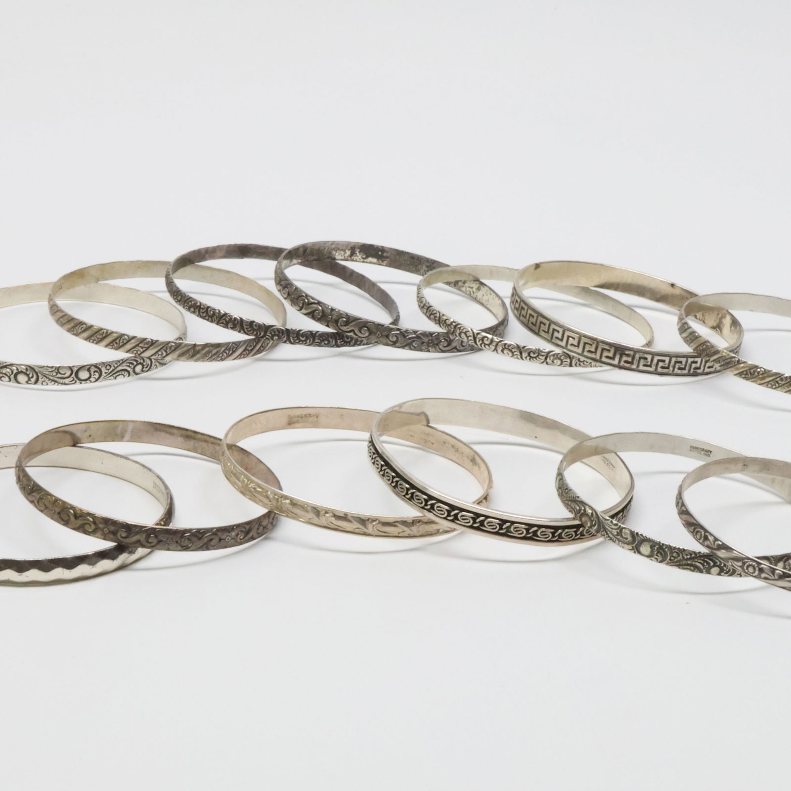 DANECRAFT; Thirteen Modernist Sterling Silver Bangle Bracelets (1 of 3)