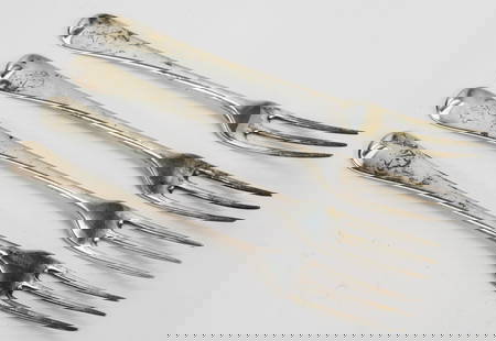 Hester Bateman, London, 1783-4; set of four sterling silver three tine forks: Length 7 3/4 inches, weight 7 troy ounces. Each with original armorial engraving to front and later small three letter monogram to reverse near marks.