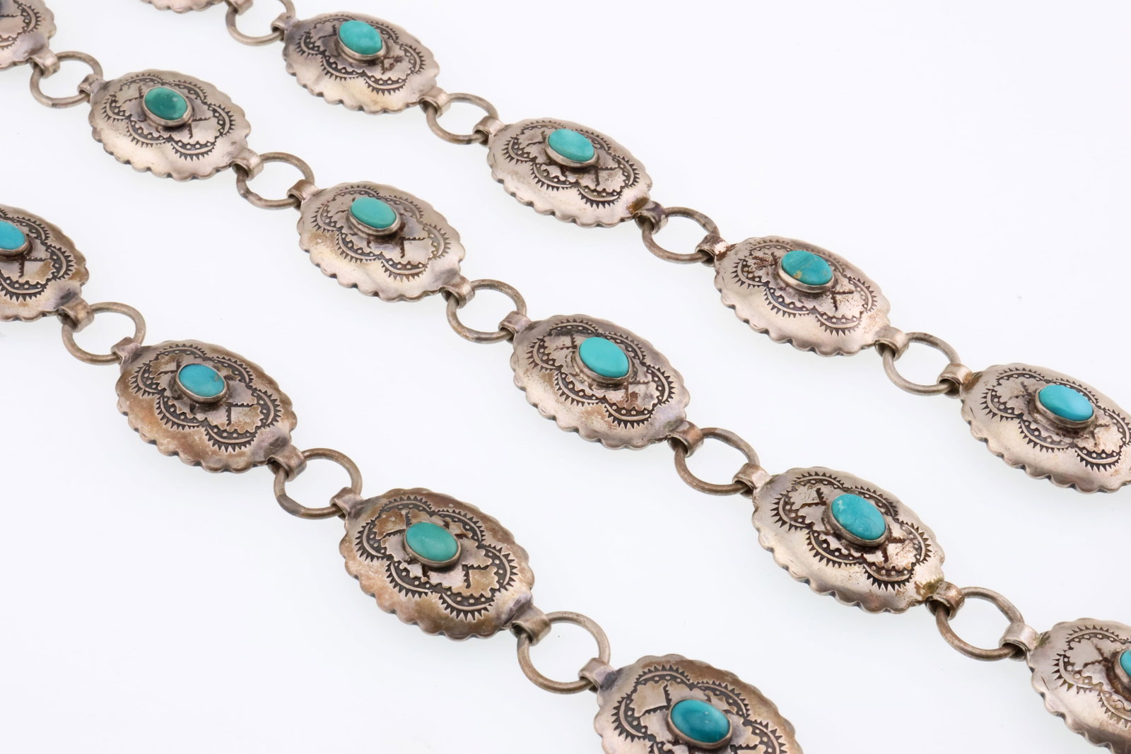 NATIVE AMERICAN; Turquoise And Sterling Silver Necklace/Bracelet Set: Marked STERLING. Lengths 7.5 inches and 15 inches. Total weight 55 grams. Good condition.