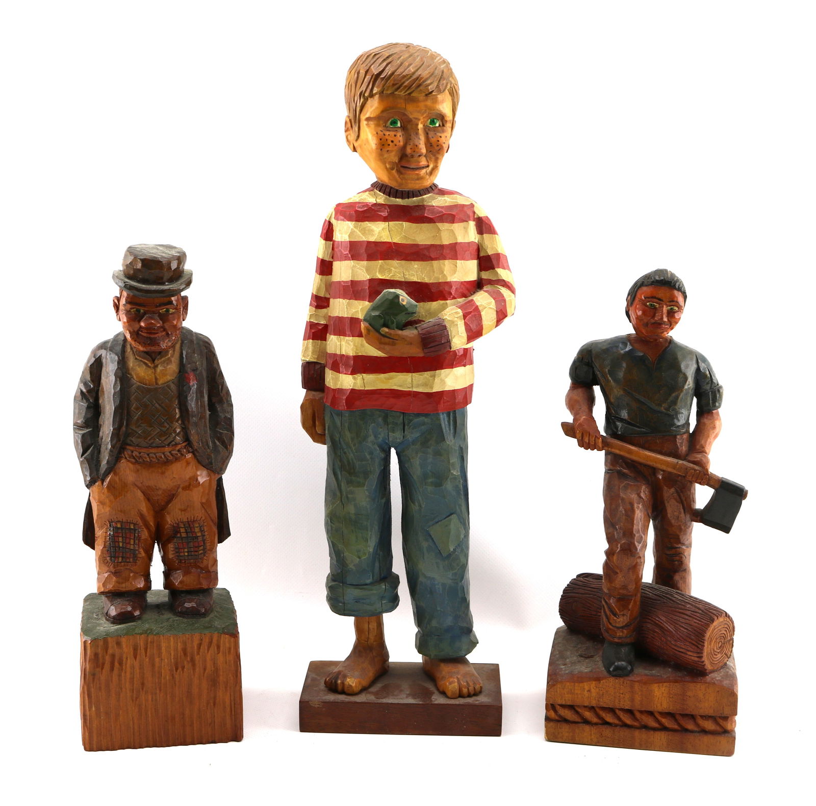 (3) Outsider / Folk Art Polychrome Painted Wood Carvings of a Boy, a Bum, and a Lumberjack: Tallest: 17 1/2 inches high. One signed and dated, another initialed, last unsigned. Good condition.