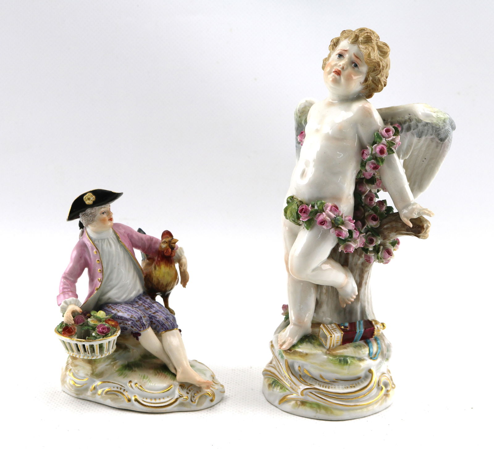 Two Antique Meissen Porcelain Figures, Tied Up Cupid and Boy with Rooster: Early 20th century or earlier. Tallest: height 7 1/4 inches. Boy with rooster: sporadic spots of restoration to one hand, rooster's tail, and hat, one flower completely missing. Cupid: missing two fin