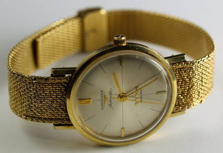 14k YG Longines Automatic Admiral Mens Wristwatch: Longines Automatic Admiral cased in 14k YG with 14k band. Overall measures 1 3/8" in length with a case diameter of 8 7/16". Weighs 62.6 grams.