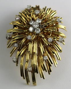 18k YG & Diamonds Tiffany & Co. Brooch: 18k YG brooch set with diamonds by Tiffany & Co. Measures 2 1/8" in height, 1 1/2" in width. Weighs 28 grams. Diamonds have a total Ct weight of approximately 1.36 cts and have a Color of G-H and Clar