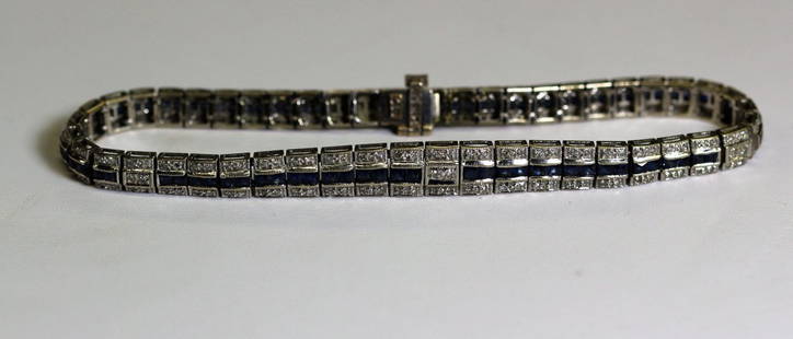 Art Deco 14k WG Diamond & Sapphire Bracelet: Art Deco bracelet done in 14k WG set with diamonds and sapphires. Measures 7 3/4" in length, 1/4" in width. Weighs 14.1 grams.