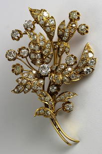 Victorian 18k YG & Diamond Floral Brooch: Victorian floral brooch done in 18k YG set with diamonds. Measures 2 5/8" in height, 1 5/8" in width. Weighs 18.8 grams. Diamonds are old mine cut and rose cut stones ranging in color and clarity appr