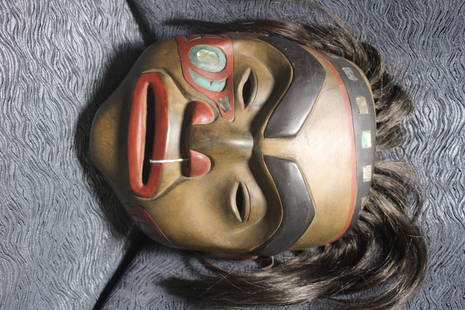 Northwest Coast Carved Mask: Painted and inlaid with abalone.