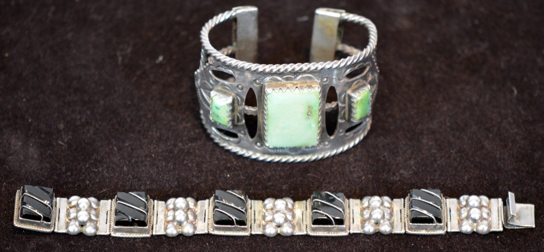 Two Piece of Sterling Jewelry Lot: Item 1 is a Native American Sterling and Turquoise BraceletItem 2 is a Vintage Mexican Sterling and Onyx Bracelet. Total lot weight is 69.7 dwt
