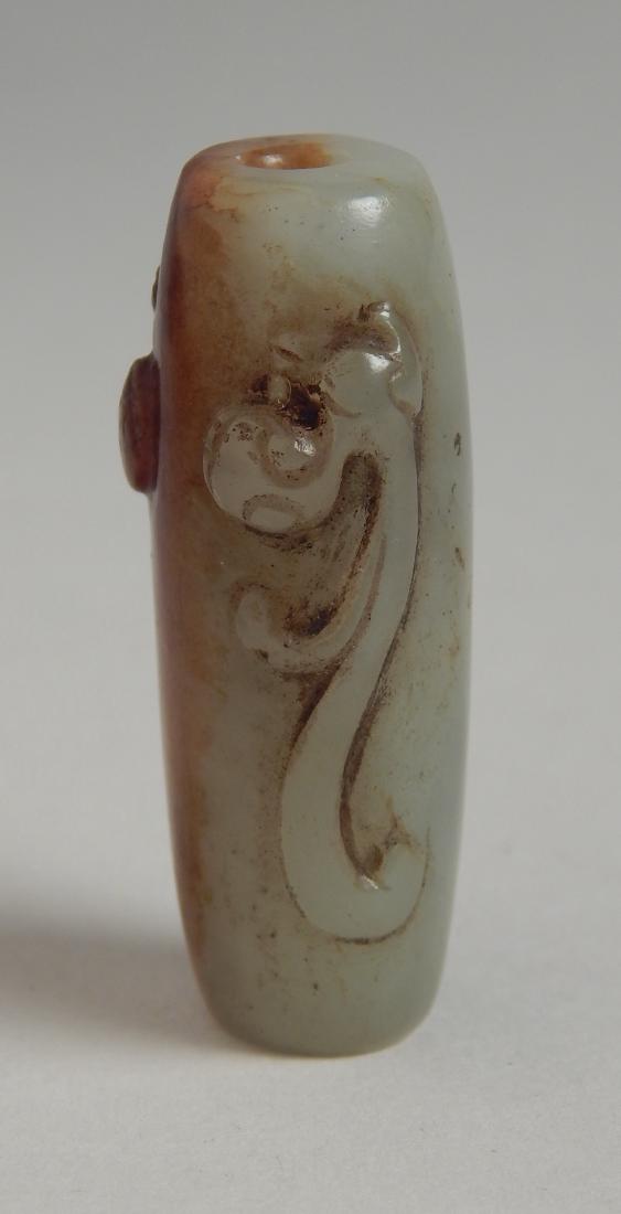 Archaic jade bead: Archaic jade bead ornamented with hydra 1 5/8''