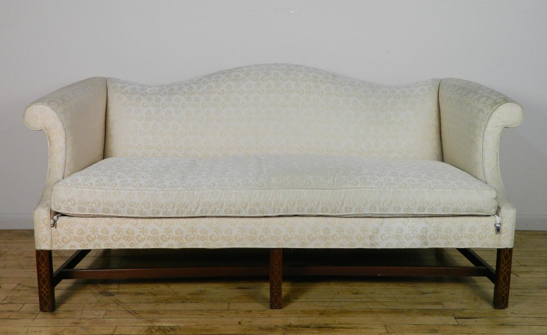 Camel back sofa: Camel back sofa, with down cushions, upholestry is worn with slight discoloration. 72''/60''w. with/without arms, 21''d. cushion, 33 1/2''h