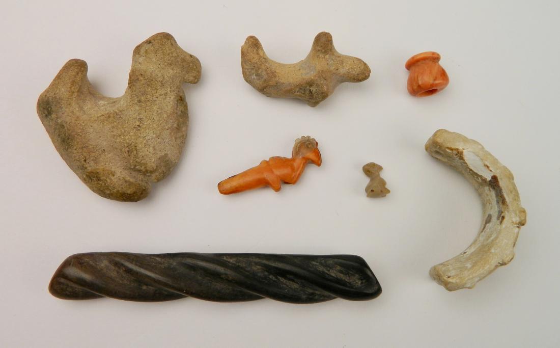 7 Pre-Columbian items: 7 Pre-Columbian items- 1.) Chimucoral bead; 2.) Mochica Fetish; 3.) Jalisco clay animal; 4.) Jalisco stone animal; 5.) Peruvian Fetish; 6.) Mayan nose piece; 7.) Olmaca ceramic bead.