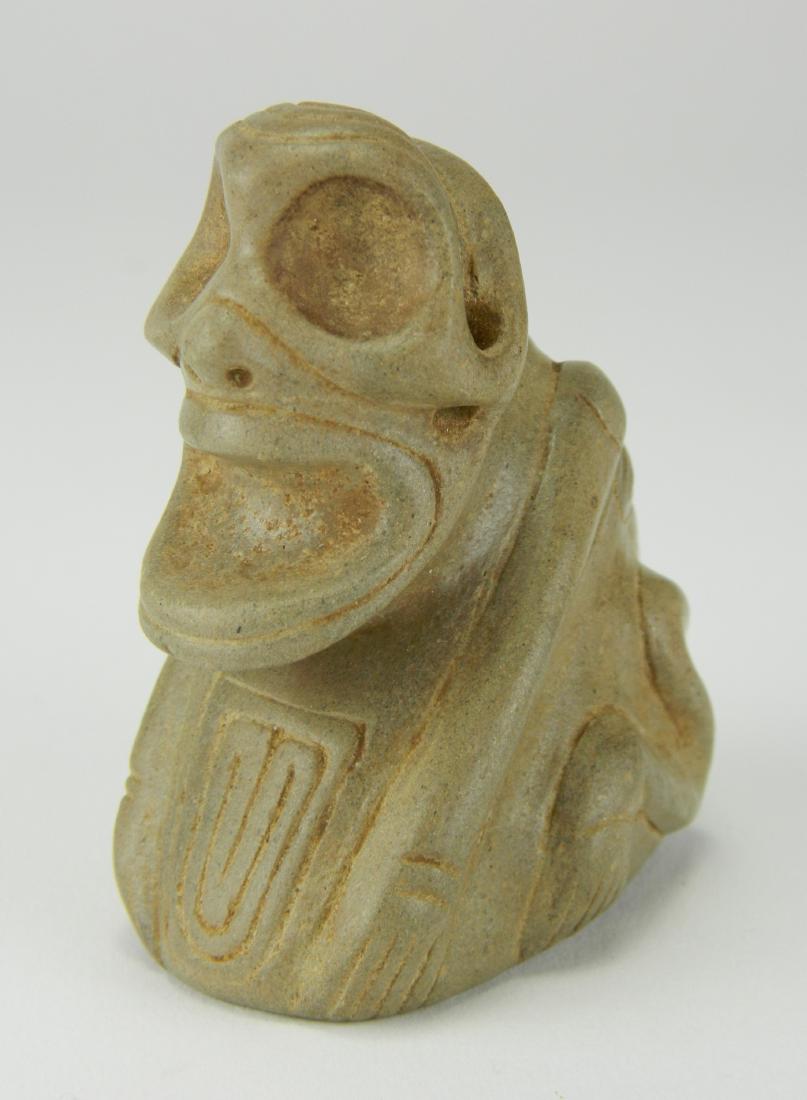 Taino Cemi/ stamp: Taino. Human to frog transformation Cemi/Stamp. Though traditionally called a stamp the carved designs represented on the bases were symbols not stamps. The piece depicts a frog like head with huge ey