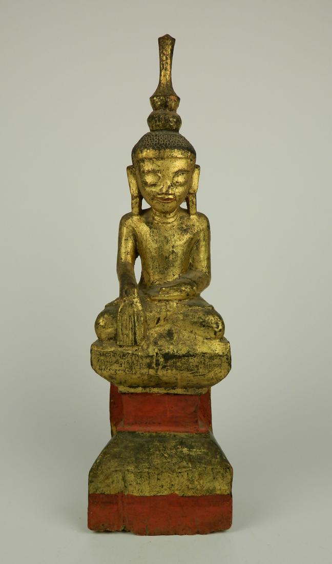 Carved and painted wood buddha: 19th/ 20thc. Carved and painted statue of Buddha, some damage and wear. 19'h