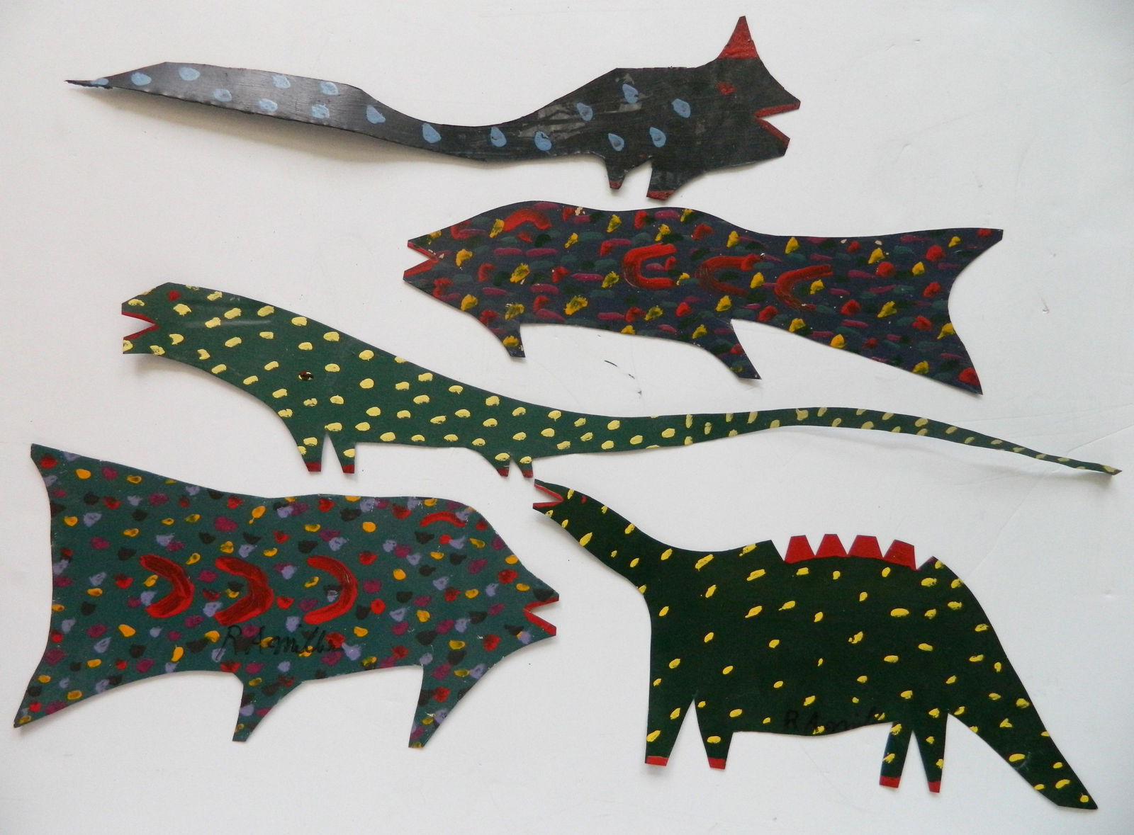 R. A. MIller- tine cut-outs: Reuben Aaron Miller (American 1912-2006)- Dinosauers, Fish- 5 painted tin cut-outs, all signed R. A, Miller, various sizes.