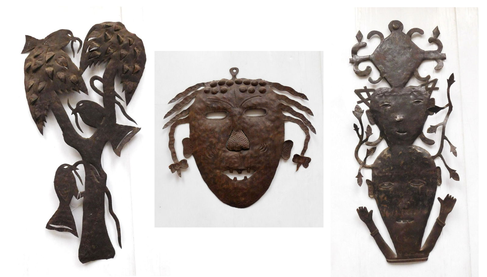 3 Gabriel Bien-Aime sculptures: Gabriel Bien-Aime (Haitian 1951- )- Birds in Trees; Two Faces & Face- 3 metal drum sculptures, all signed. 34 1/2"h (largest)