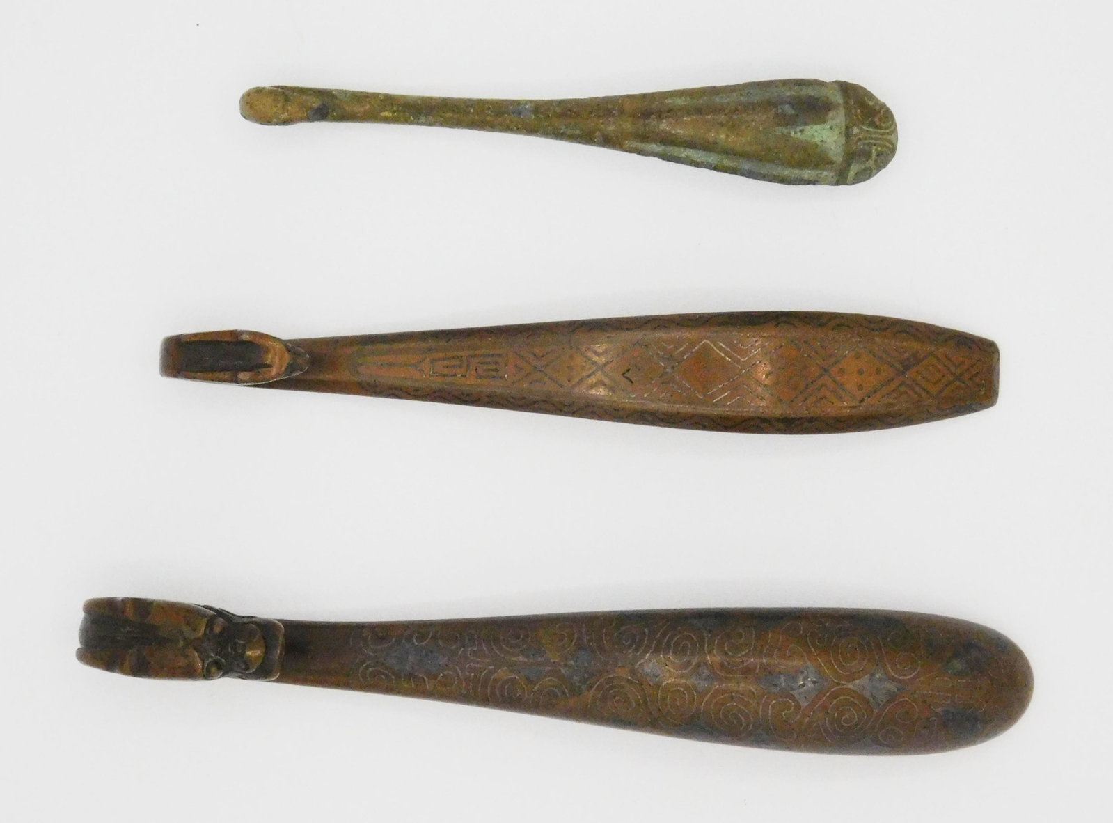3 Bronze belt hooks: 3 Bronze belt hooks- 1.) Sung, 4 3/4''; 2.) Sung, signed, 4 1/8''; 3.) Han, has some erosion, 3''.