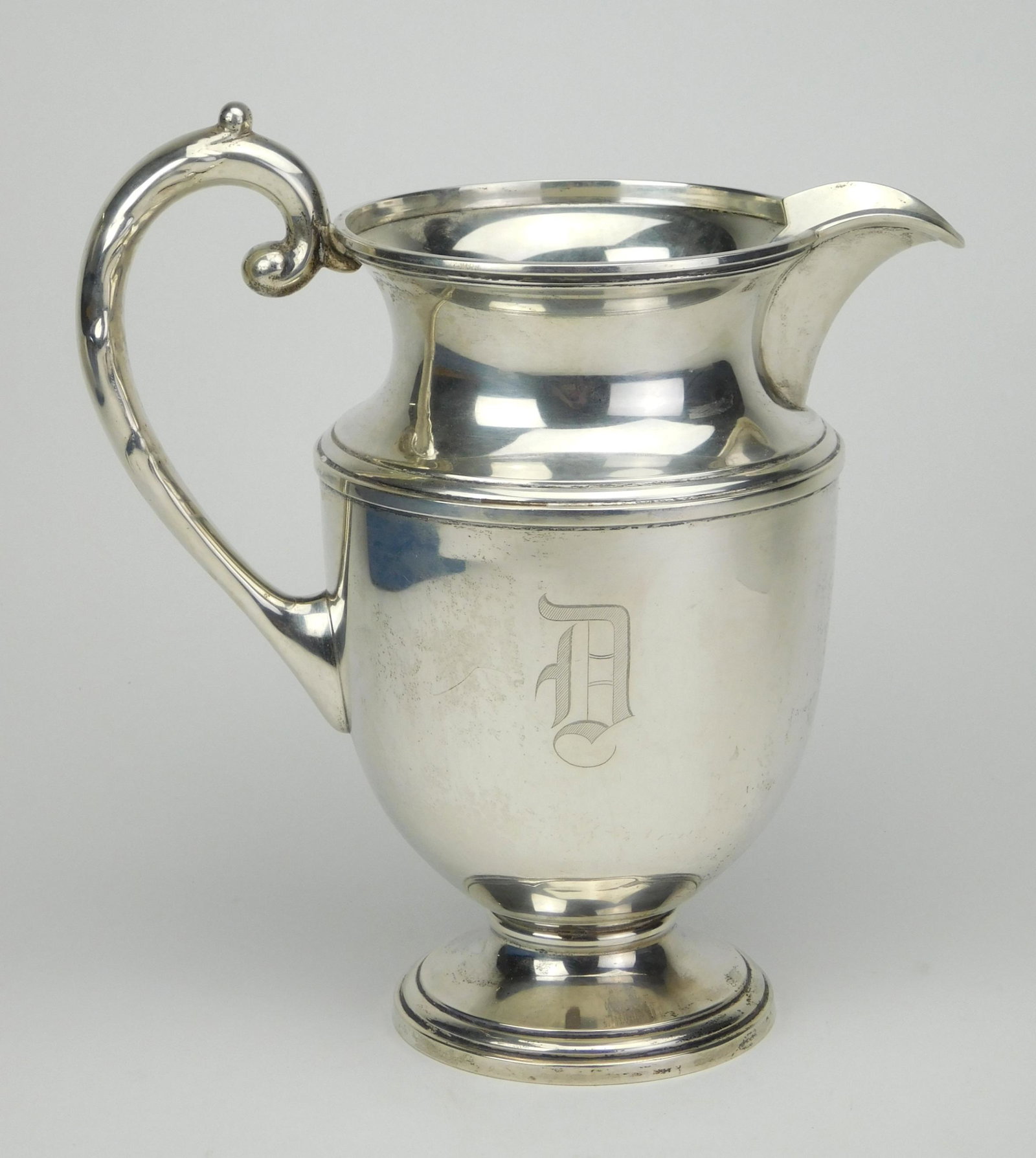 Mueck & Carey sterling silver pitcher: Mueck & Carey sterling silver pitcher, marked on bottom, engraved 'Webb C. Ball trophy/ G.W.G.A. 1952' on bottom, monogrammed with the letter 'D'. 10''h 598 grams