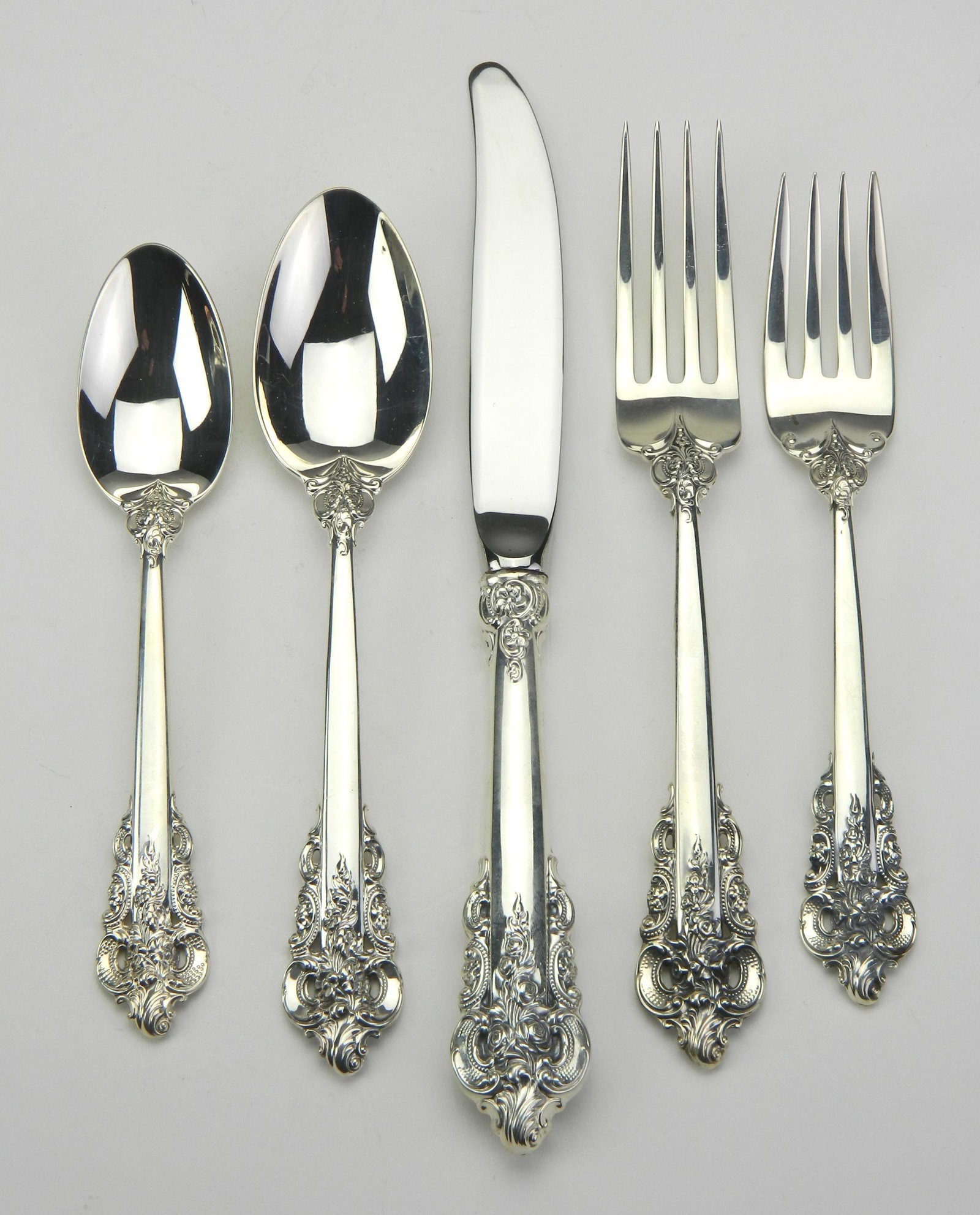 Wallace: Wallace 'Grand Baroque' sterling silver flatware service, 5 piece setting for 12, teaspoon, place spoon, salad fork, place fork and knife, excellent condition. approximately 2490 g; together with a pa