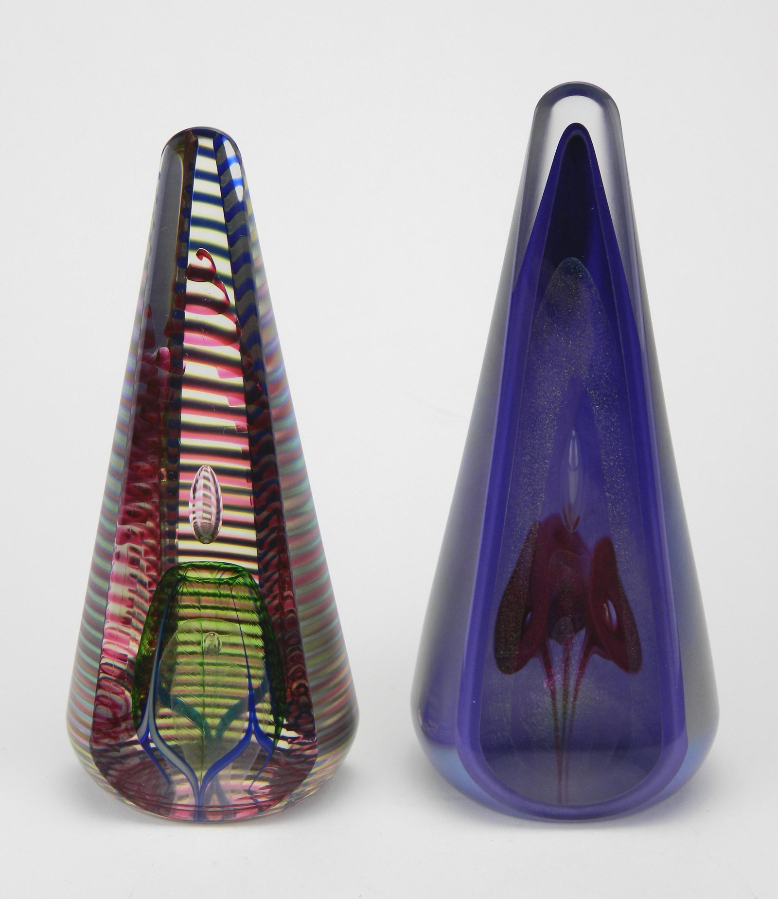 2 Stuart Abelman glass paperweights: 2 Stuart Abelman art glass paperweights, 1996, dissected cone form, both signed and dated on bottom, very good condition. 7 1/2''; 7'' h