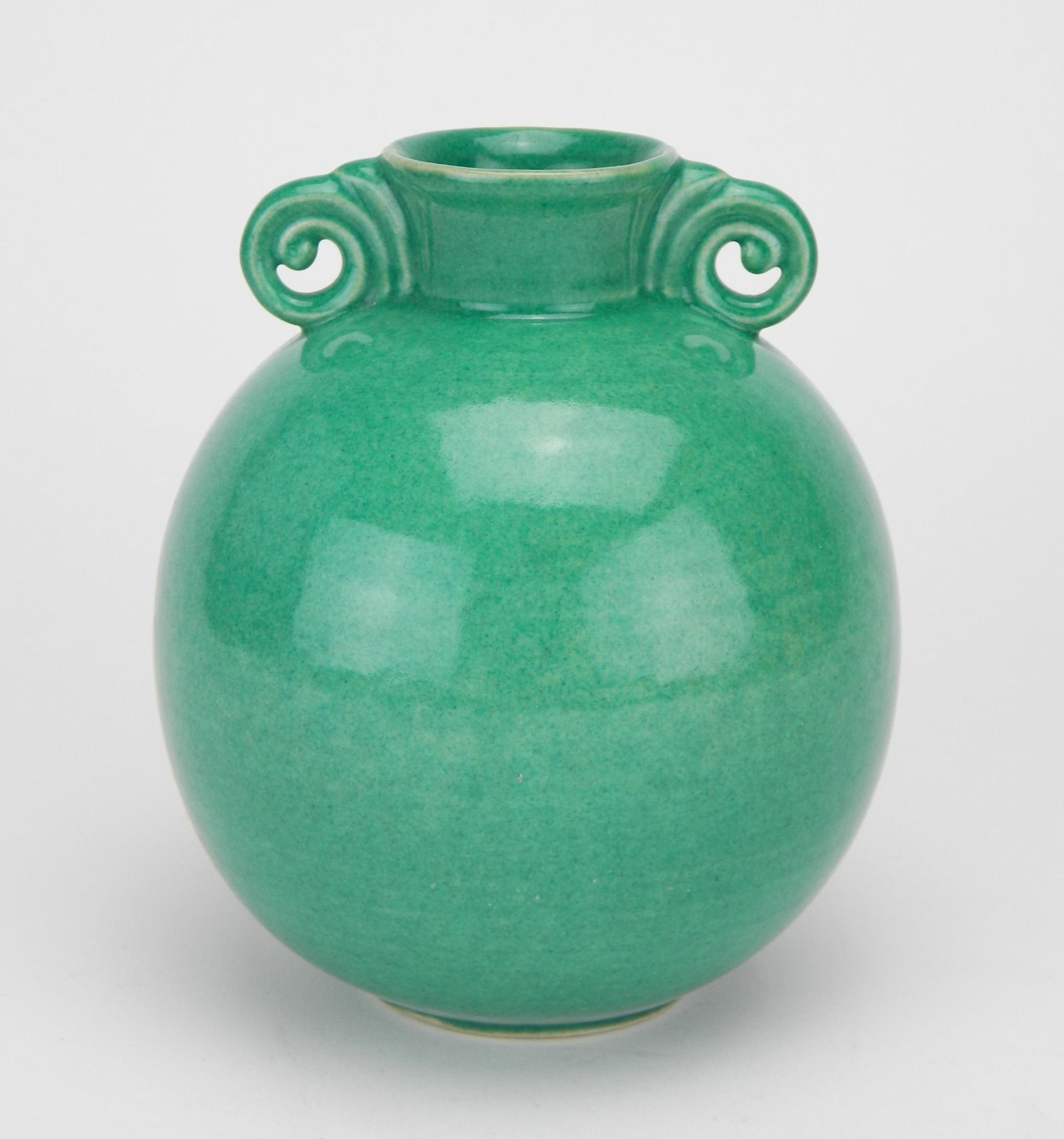 Cowan pottery vase, Schreckengost design: Cowan pottery vase, designed by Viktor Schreckengost, globular form with scroll handles, in green marked on bottom, good condition. 6''h