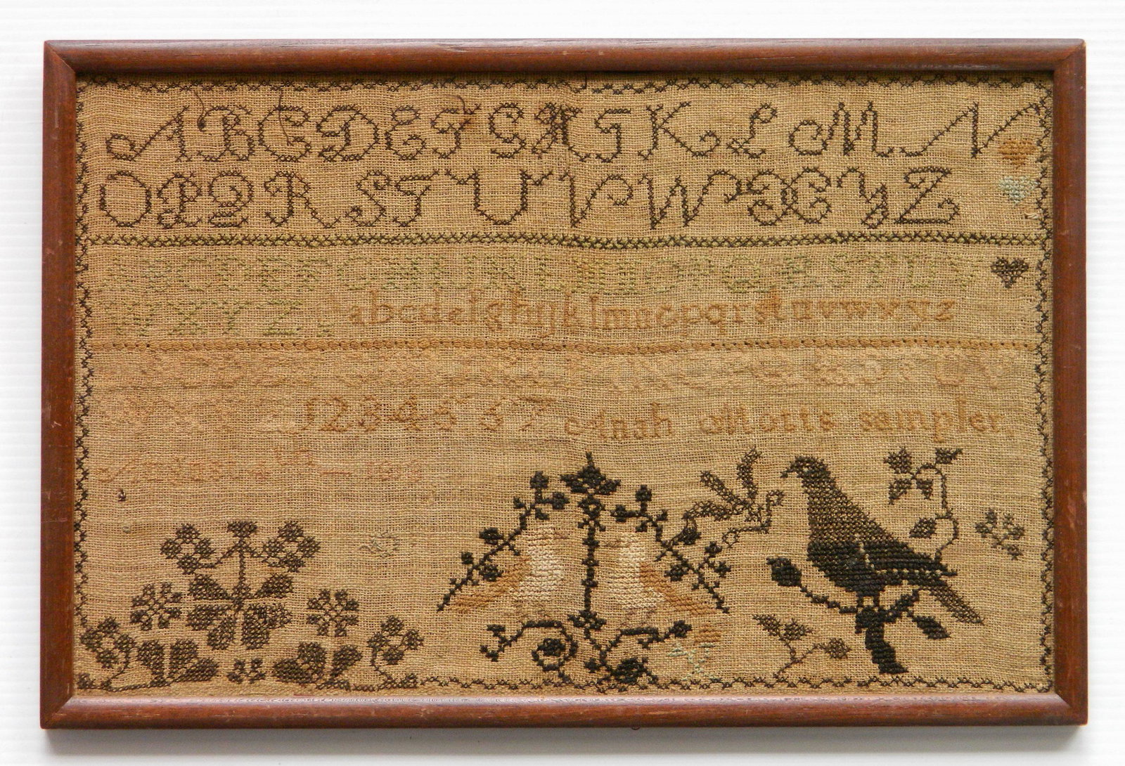 19th/ 20th c. American sampler: 19th/ 20th c. American sampler, with alphabet and numbers and ornament with birds and foliage, by Anah Motts. 91/2 x 15''
