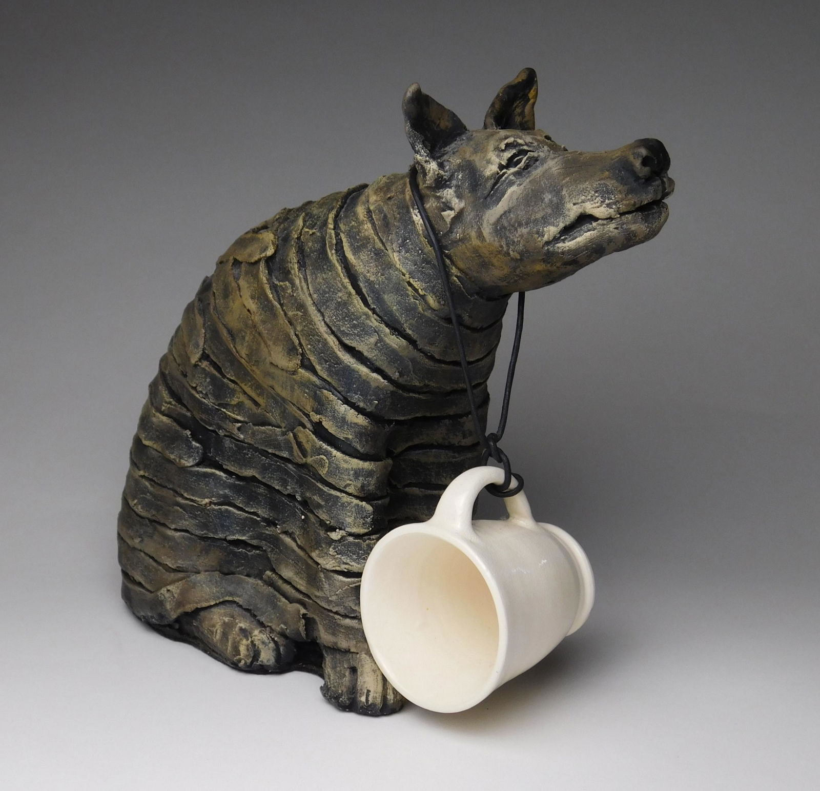 Christine Federighi ceramic: Christine Federighi (American 1949-2006)- Dog with Cup- ceramic sculpture, very good condition. 8 x 9 x 3 1/2''