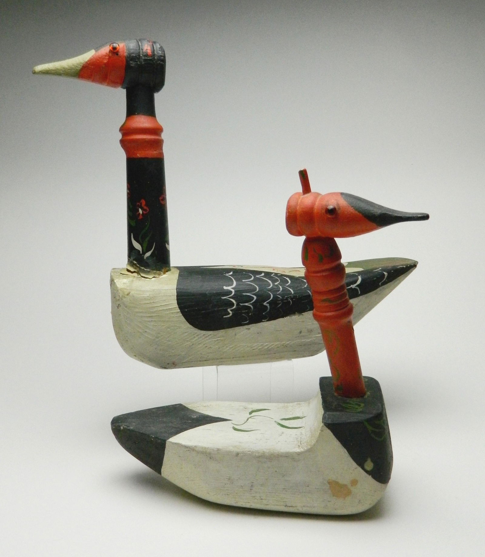 Albert Pels ducks: Albert Pels (American 1910-1998)- Pair of duck decoys, hand-painted wooden suclptures, 1 is signed Pels, some paint loss, chipping and staining. 12 x 3 x 11 3/4'' & 9 x 3 1/2 x 11''