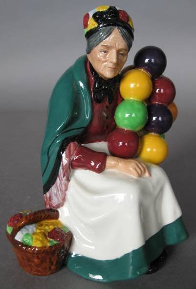 Royal Doulton Porcelain Figurine: Royal Doulton Porcelain Figurine- ''Old Balloon Seller'' HN 1315, designed by Leslie Harrandine, issued 1929-1998, signed in black marker on bottom- 'Michael Doulton 22 Sept. 1976, very good condition