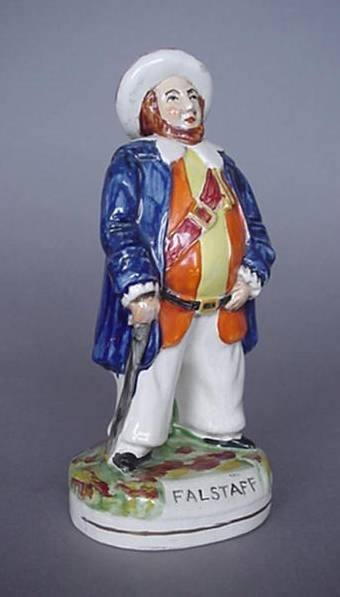 English Staffordshire figurine, Falstaff: English Staffordshire porcelain figurine- ''Falstaff'', a few paint flakes otherwise good condition together with a figurine of Man on Couch waving- repaired at top and has a hairline. 7 1/4''