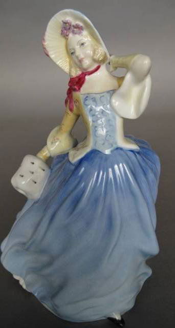 Royal Doulton Porcelain Figurine: Royal Doulton Porcelain Figurine- ''Autumn Breezes'' HN 3736, designed by Leslie Harrandine, issued 1997-1998, from the series: M. Doulton Events, very good condition. 7 1/2'' Provenance: Whitley coll