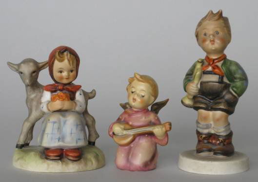Three Hummel figurines: Three Hummel figurines including HUM 182 Good Friends- 3 3/4''h; HUM 97 Trumpet Boy- 5''h and HUM 214/O Serenade- 3''h, some minor crazing otherwise good condition.