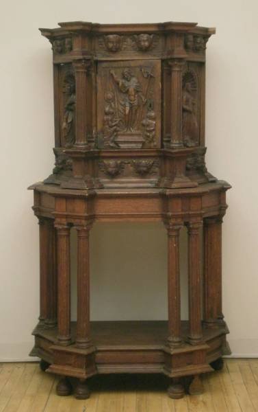 18th c. European carved oak reliquary: 18th c. European carved oak reliquary- the door with figure of Christ and two kneeling knights, the sides with figures of saints, the cornice and base with cherubic masks, raised on a columnar base. 6