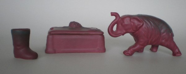 3 Van Briggle Pottery items: 3 Van Briggle Pottery items- Elephant figurine, Tooth pick in the form of A Boot, Covered box ornamented with pine cone and branch on lid, Elephant has a repaired chip on front left foot, various size