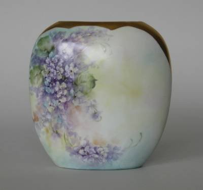 H. Litkovitz hand-painted porcelain pillow vase: Hand-painted porcelain pillow vase by Helen Litkovitz, decorated with violets, with applied gold top, signed, minor air bubbles, otherwise good condition. 7 1/2''h
