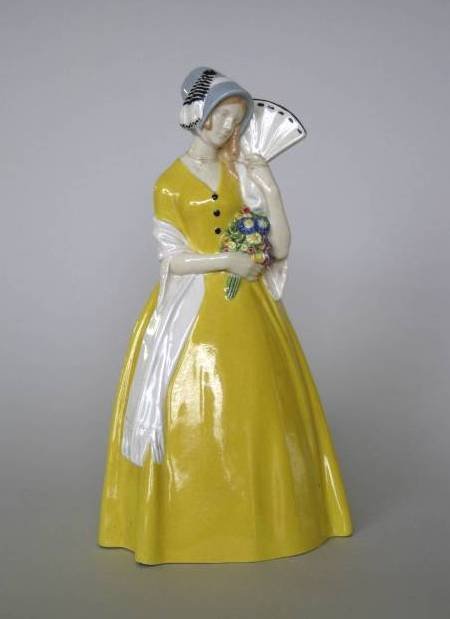 Wiener, Werkstatte porcelain figure: Wiener Werkstatte glazed porcelain figure- Standing Woman, marked on bottom 'Austria' and Werkstatte symbol, repair on upper half and some pitting in front, otherwise good condition. 12 1/4''h