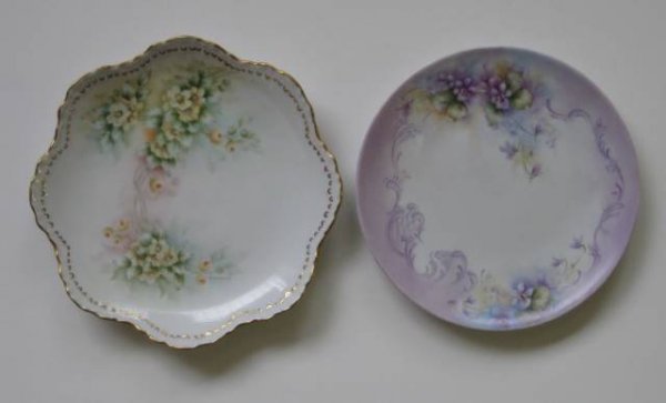 H. Litkovitz two hand-painted porcelain plates: Two hand-painted porcelain plates by Helen Litkovitz- 1 decorated with green and yellow flowers, scalloped and applied gold plate; 1 decorated with violets with lavender scrolling; both signed, scallo