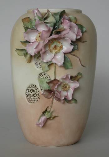 Helen Litkovitz hand-painted vase: Helen Litkovitz hand painted porcelain vase decorated with applied flowers on a pink and cream ground, marked on bottom, very good condition. 10''h