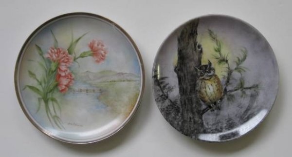 H. Litkovitz two hand-painted porcelain plates: Two hand-painted porcelain plates by Helen Litkovitz- 1 depicting a scene of an owl on branch; 1 decorated with carnations, depicting a water and mountain scene in background, with silver band edge, b