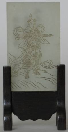 Asian School jade plaque: 19th c. Asian School plaque of Buddhist deity figure etched in jade, set in wooden stand. 2 1/2''h 1 1/2''w